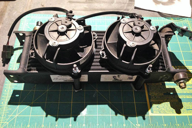 Here are the fans mounted on the back side of the cooler &mdash; they are puller fans. Rubber fuel line slipped over the long mounting screws prevents metal to metal contact.