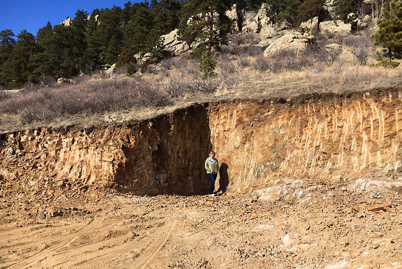 Here is Kris standing at the base of the initial cutout for the house. The wall behind her is 12 feet tall. The cutout was eventually increased to 15 feet deep for the foundation.