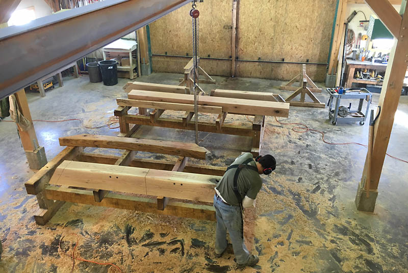 Matt working on two rafter extensions.